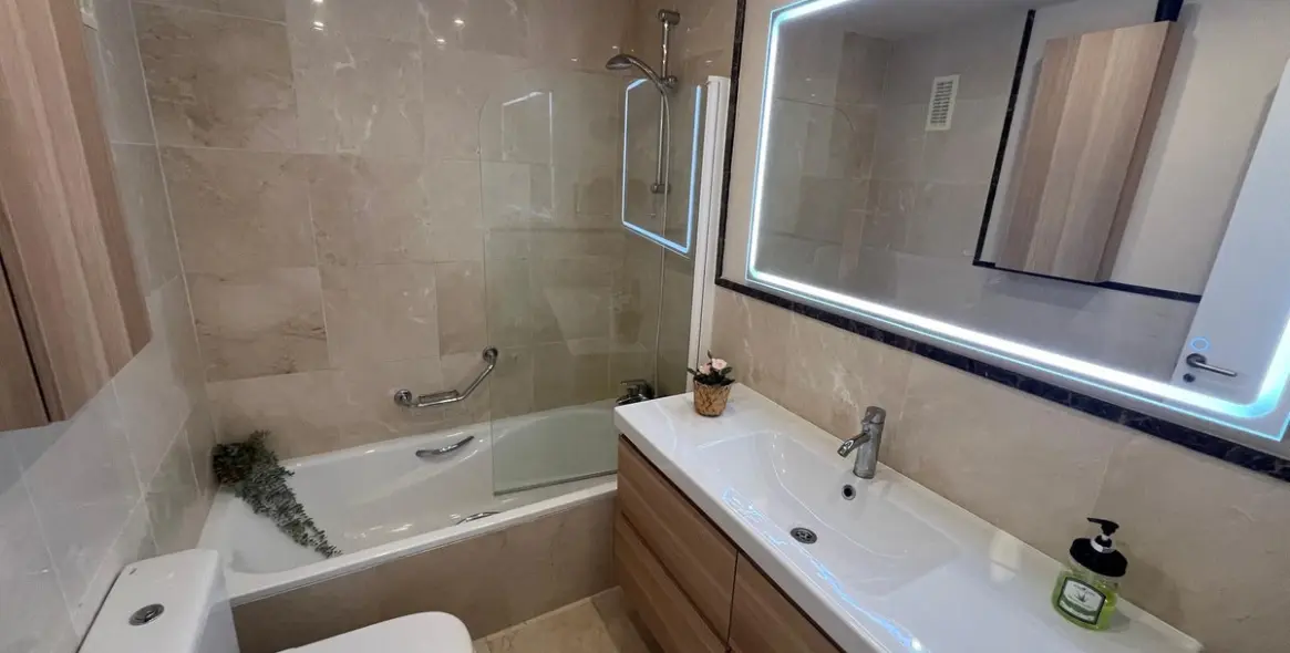 Sale of middle floor apartment in Torrox Costa 24