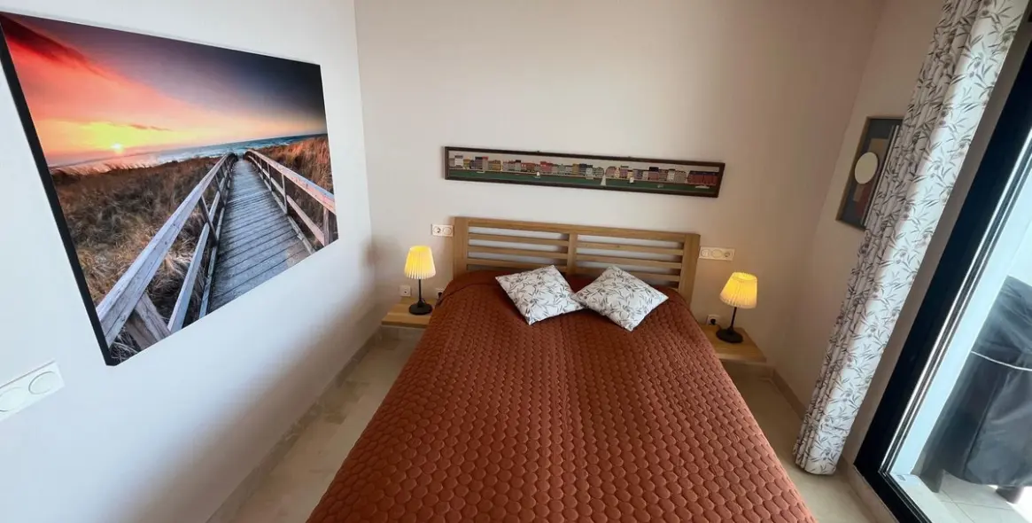 Sale of middle floor apartment in Torrox Costa 26